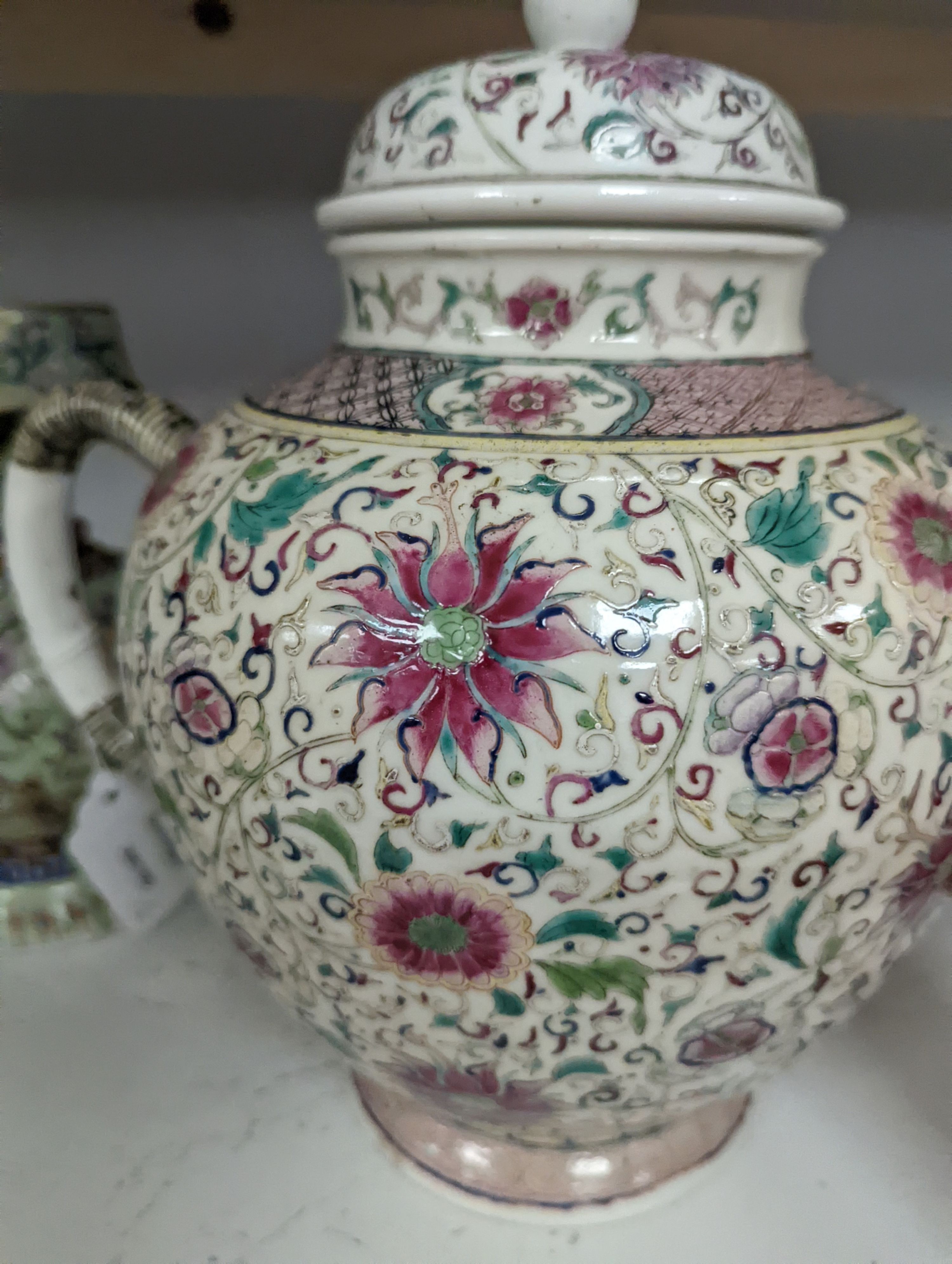 A large 19th century Chinese famille rose wine pot, and another wine pot, tallest 27cm